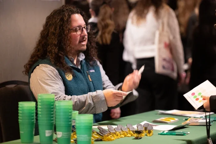 UAA Healthcare Representative Handing Out Materials